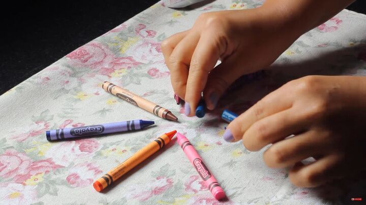 how to make lipstick with crayons fun colorful diy tutorial, Removing the paper from the crayons