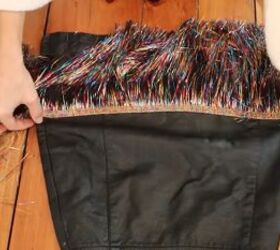 need a unique holiday outfit make this festive diy tinsel skirt, Stretching the skirt while gluing the tinsel