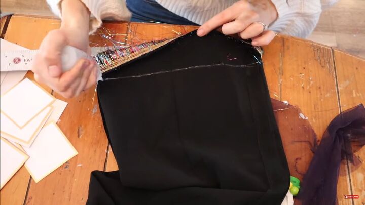 need a unique holiday outfit make this festive diy tinsel skirt, Lining the hem with fabric glue