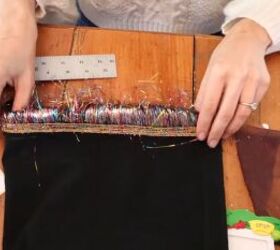 need a unique holiday outfit make this festive diy tinsel skirt, Folding the trim lined hem onto the glue