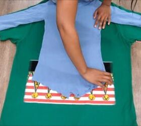 how to make an easy diy elf costume using a novelty christmas t shirt, Laying a romper on top of the elf t shirt