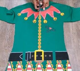 how to make an easy diy elf costume using a novelty christmas t shirt, Cutting down the center of the t shirt