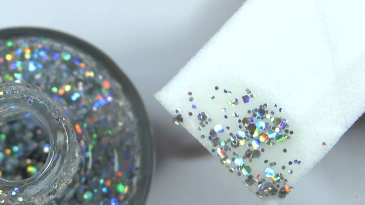 how to rock magical glitter snowflake nails this festive season, Applying glitter nail polish with a sponge