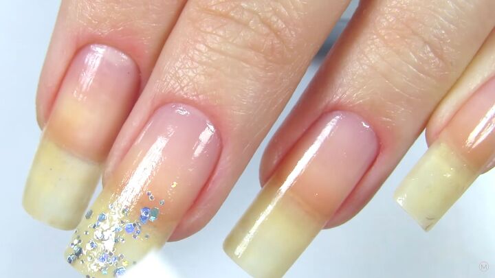 how to rock magical glitter snowflake nails this festive season, Dabbing glitter onto the nail tip