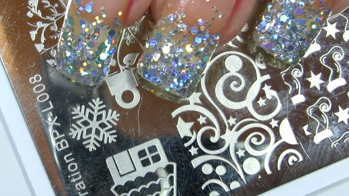 how to rock magical glitter snowflake nails this festive season, Christmas nail stamp plate with a snowflake