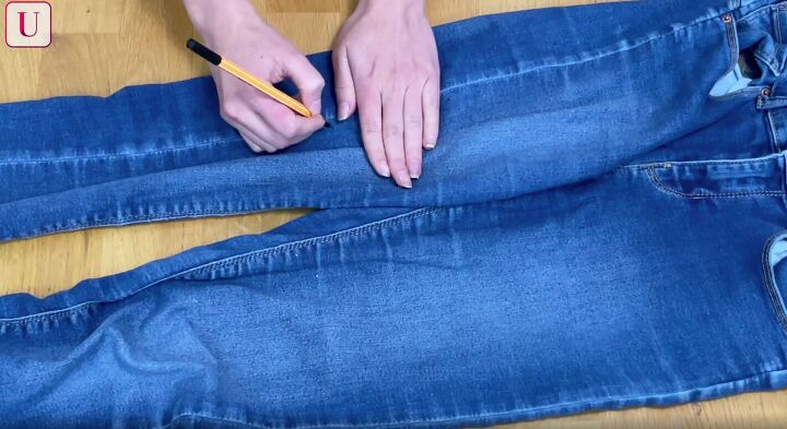 how to customize your jeans 3 different ways for a totally unique look, Making marks down the side seam of jeans