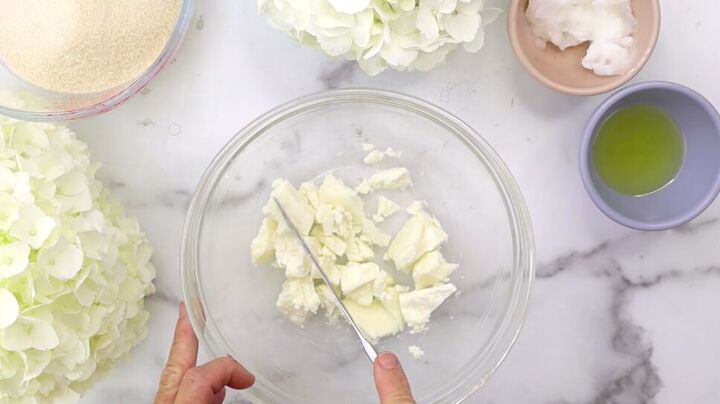 try this easy homemade whipped body scrub recipe with rose fragrance, Cutting up the mango butter