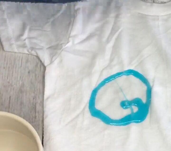 9 diy laundry hacks amazing stain removal tricks you need to know, Squirting Dawn dishwashing liquid on the stain