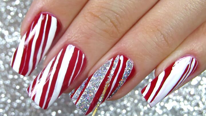 how to do cute red white candy cane christmas nails for the holidays, Christmas nail designs like candy canes