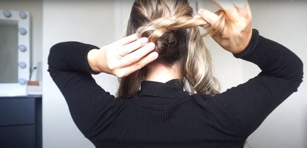2 cute easy christmas updos for long hair you can try at home, Wrapping sections of hair into a bun