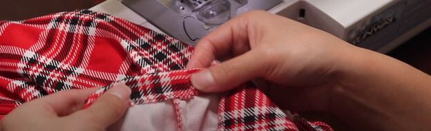 how to make a festive diy plaid christmas dress for the holidays, Hemming the sleeve cuff with elastic
