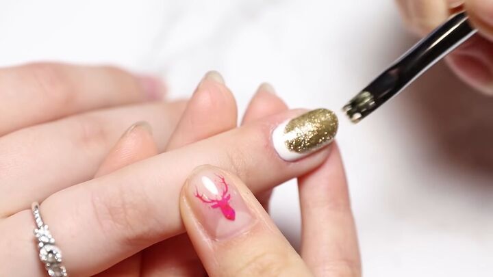 easy red white gold christmas nail art with festive stickers, Painting a scallop of gold onto a white nail