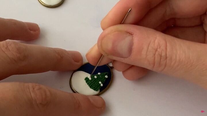 how to make charming diy christmas earrings out of polymer clay, Pressing the white clay with a needle