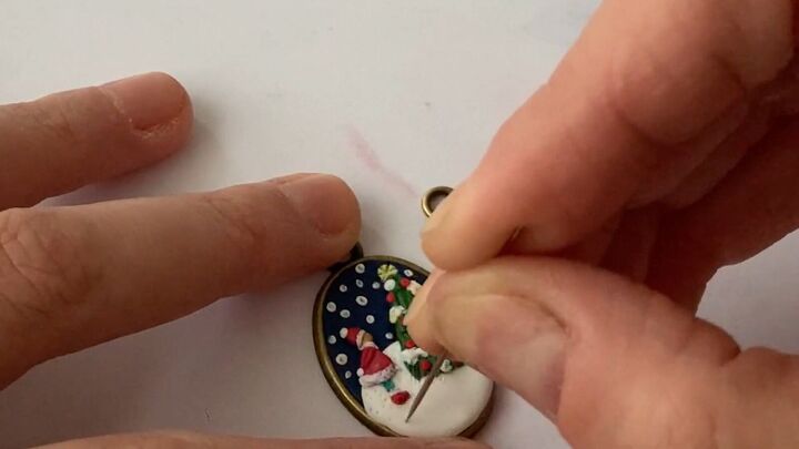 how to make charming diy christmas earrings out of polymer clay, Using a needle to add detail