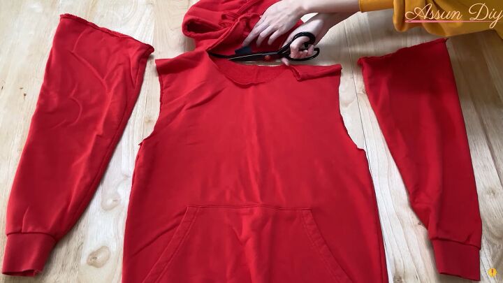 how to make a cute diy christmas dress out of an old red hoodie, Cutting off the hood