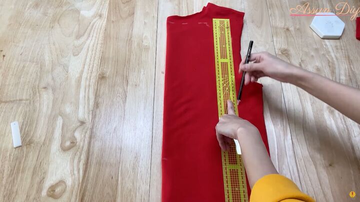 how to make a cute diy christmas dress out of an old red hoodie, Measuring the top of the Christmas dress