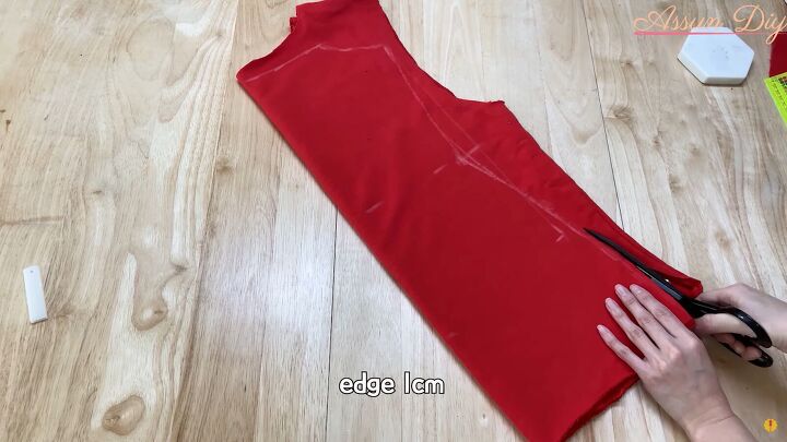 how to make a cute diy christmas dress out of an old red hoodie, Cutting out the fabric pieces