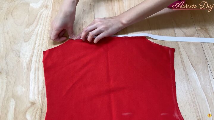 how to make a cute diy christmas dress out of an old red hoodie, Adding white trim to the red bodice piece