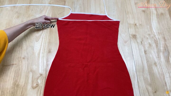 how to make a cute diy christmas dress out of an old red hoodie, Sewing up one side of the DIY Christmas dress