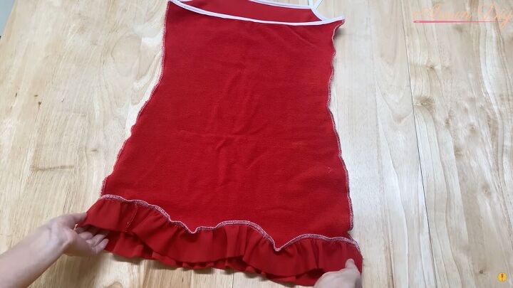 how to make a cute diy christmas dress out of an old red hoodie, Sewing the open side seam of the dress