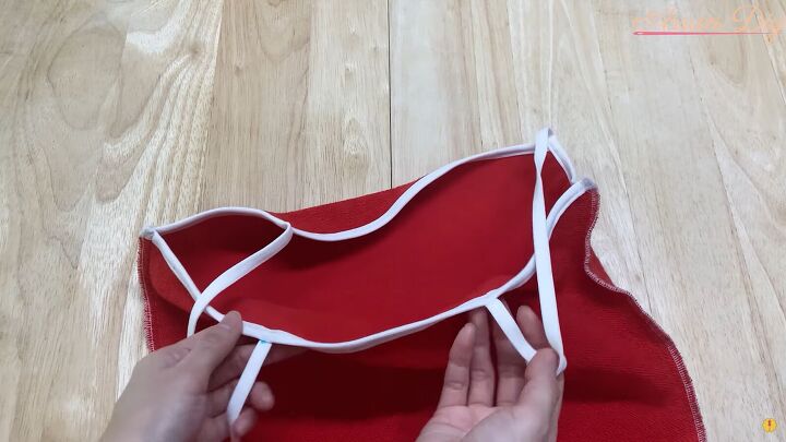 how to make a cute diy christmas dress out of an old red hoodie, Sewing the straps to the dress