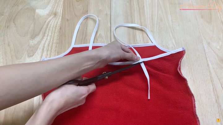 how to make a cute diy christmas dress out of an old red hoodie, Trimming the excess elastic