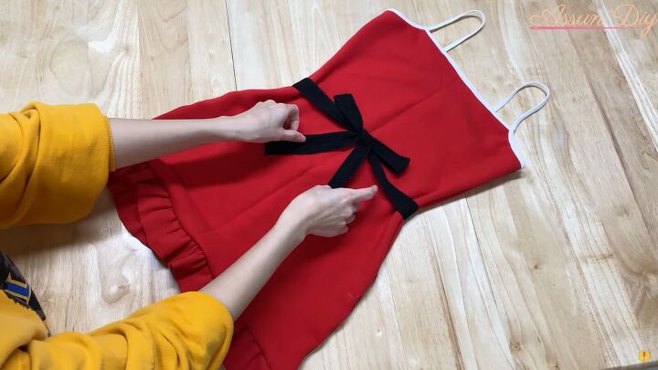 how to make a cute diy christmas dress out of an old red hoodie, Making a bow for the DIY Christmas dress