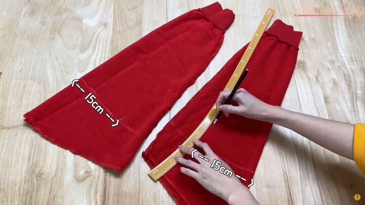 how to make a cute diy christmas dress out of an old red hoodie, Measuring sleeves for the Christmas dress