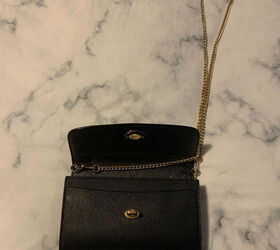 She opens the flap before putting on her crossbody, then does something unexpected