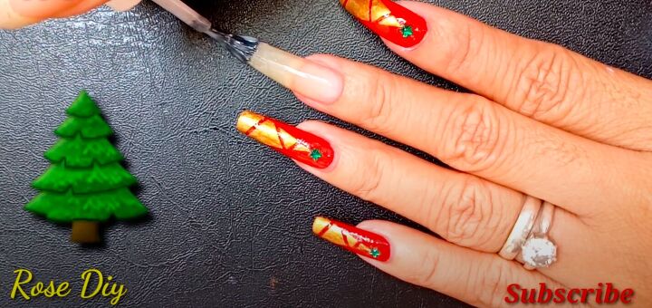 how to paint christmas trees on your nails the easiest way, Applying a base coat of clear nail polish