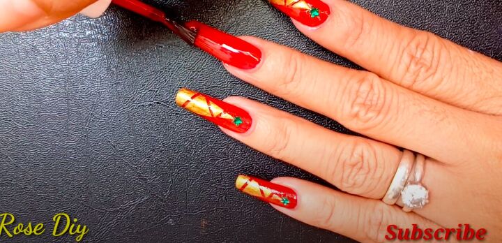 how to paint christmas trees on your nails the easiest way, Painting nails with red nail polish