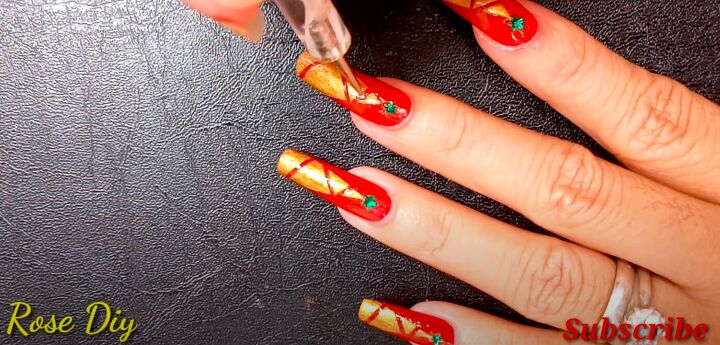 how to paint christmas trees on your nails the easiest way, Adding a bead on top of the Christmas tree