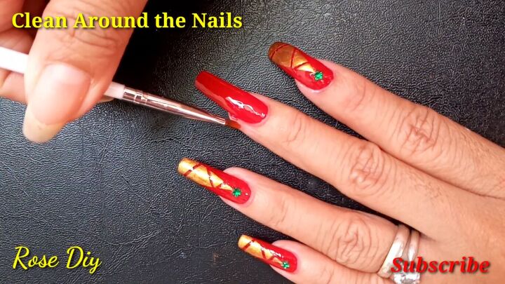 how to paint christmas trees on your nails the easiest way, Cleaning around the nails with a brush