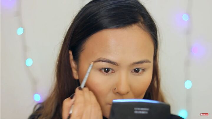 ring in the new year in style with this sultry new year s makeup look, Emphasizing the arch of the eyebrow