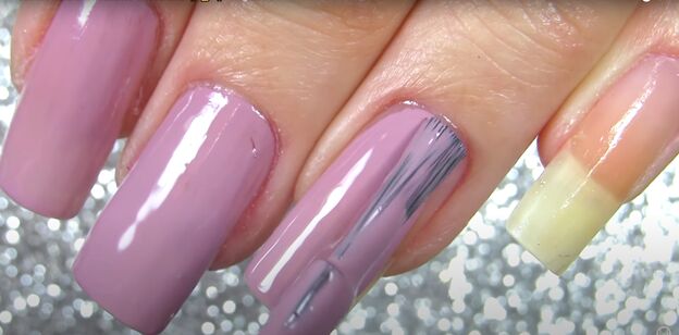 sparkly snowflake nail polish art how to draw a snowflake on a nail, Applying rose purple nail polish to nails