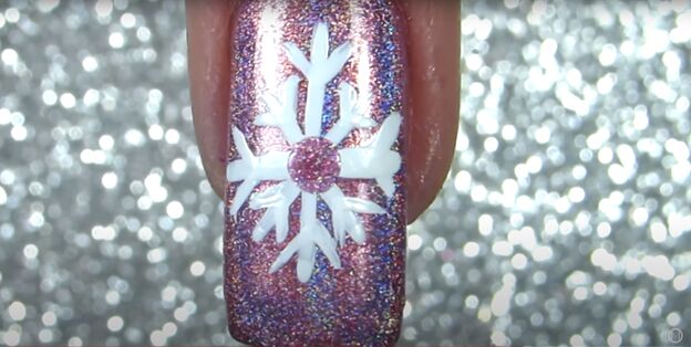 sparkly snowflake nail polish art how to draw a snowflake on a nail, Adding glitter in the center of the snowflake