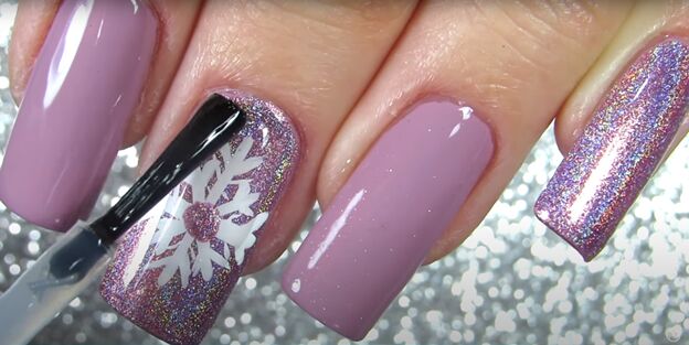 sparkly snowflake nail polish art how to draw a snowflake on a nail, Applying a clear top coat of nail polish