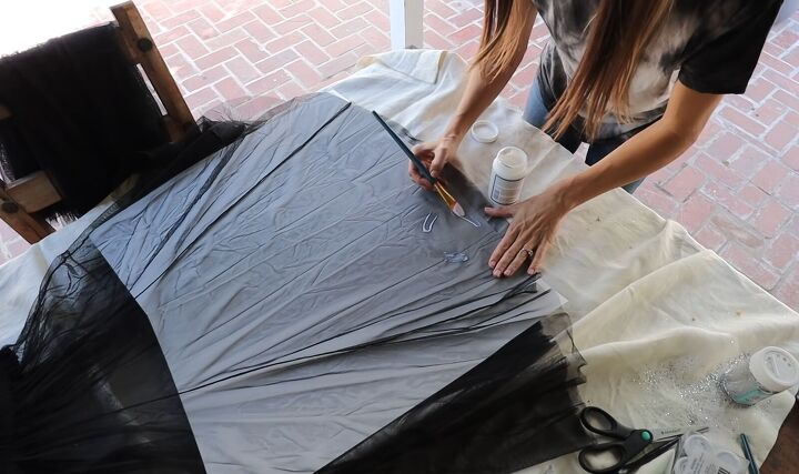 3 sparkly ways to embellish a tulle skirt for a cute diy party outfit, Painting Mod Podge on the tulle skirt