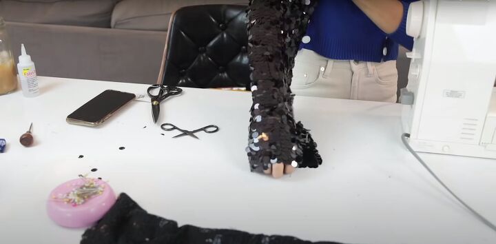 how to make a cute sparkly diy sequin jacket for the holidays, Trying on the sequin jacket sleeves