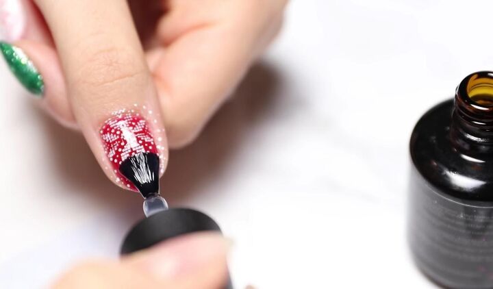 how to easily do festive white red green christmas nail designs, Applying a gel top coat to nails