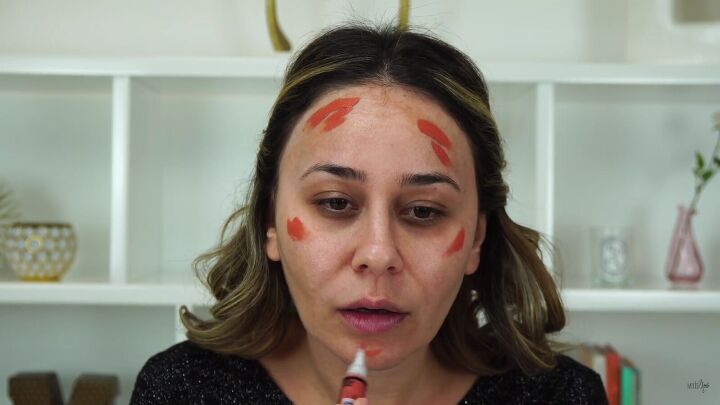 need some festive glamour try this sexy christmas makeup look, Applying color corrector to the face