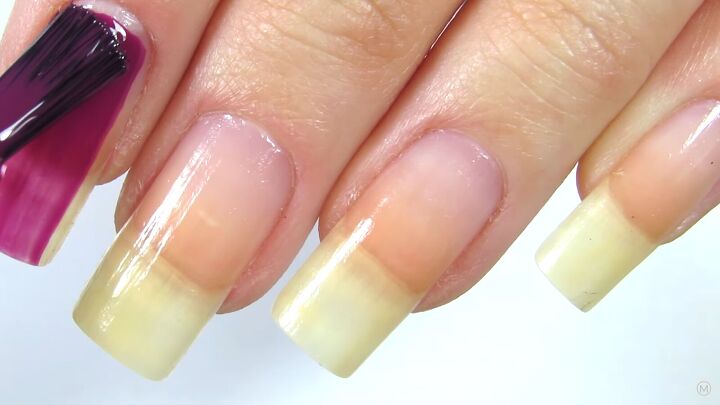 these simple gold purple christmas nails are like berries cream, Applying dark purple nail polish