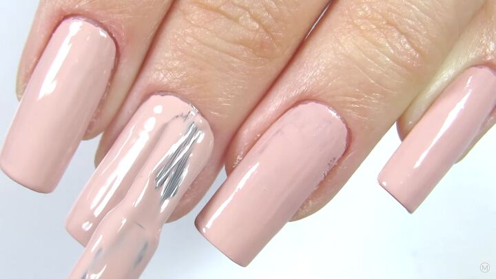 how to do a classy gold french manicure at home in 3 simple steps, Applying a pink nail polish color to nails