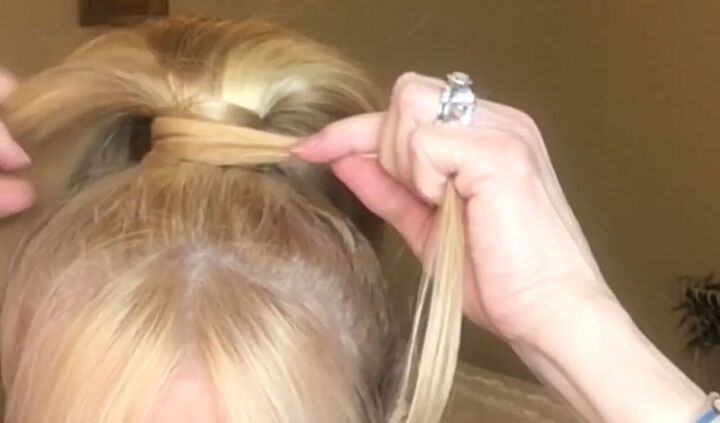 how to rock a fake ponytail on short hair trying out hair extensions, Wrapping a piece of hair around the Velco