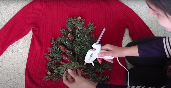 how to make your own light up christmas sweater for the festive season, Attaching the design with a hot glue gun