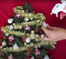 how to make your own light up christmas sweater for the festive season, Gluing the Christmas ornaments to the tree