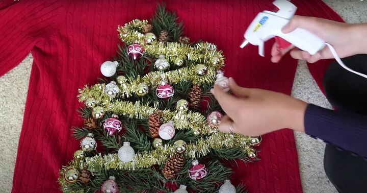 how to make your own light up christmas sweater for the festive season, Gluing the Christmas ornaments to the tree