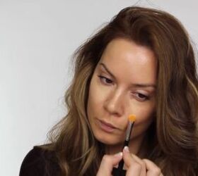 quick easy glam makeup for a new year s eve party, Applying concealer to the face