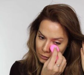 quick easy glam makeup for a new year s eve party, Blending concealer with a makeup sponge