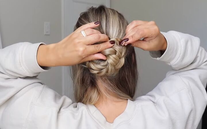 how to do a gorgeous lace french braid updo for a special occasion, Twisting the braid into a bun